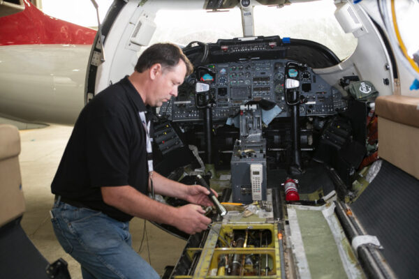 Maintenance Team Working on Engine