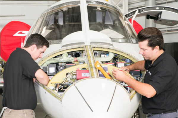 Maintenance Team Working on Engine Exterior