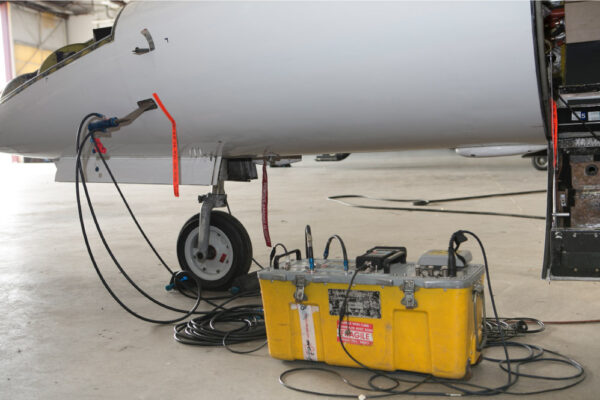 Maintenance Team Working on Learjet