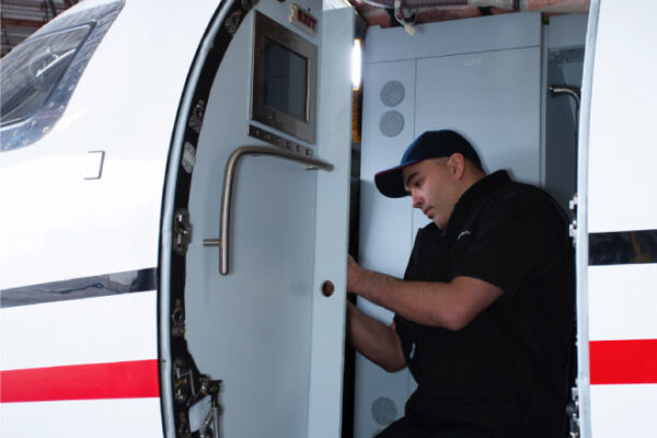 Maintenance Team Working on interior learjet