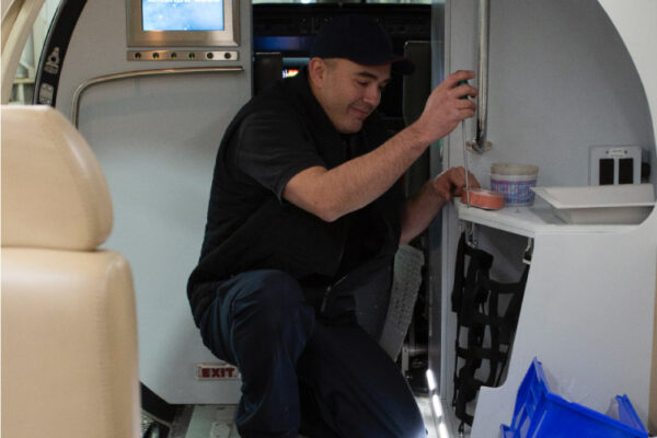 Maintenance Team Working on interior plane